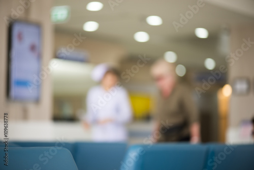 a blur photo of a nurse with an elderly woman for hospital background
