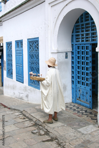 Seller jasmine flowers waiting for tourists. Sidi Bou Said