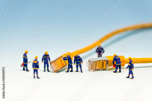 Team of techs with RJ45 network cable