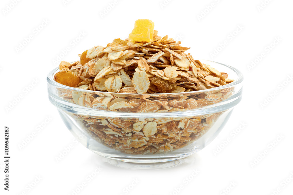 Muesli breakfast in glass bowl on white background Muesli breakfast in glass bowl on white background