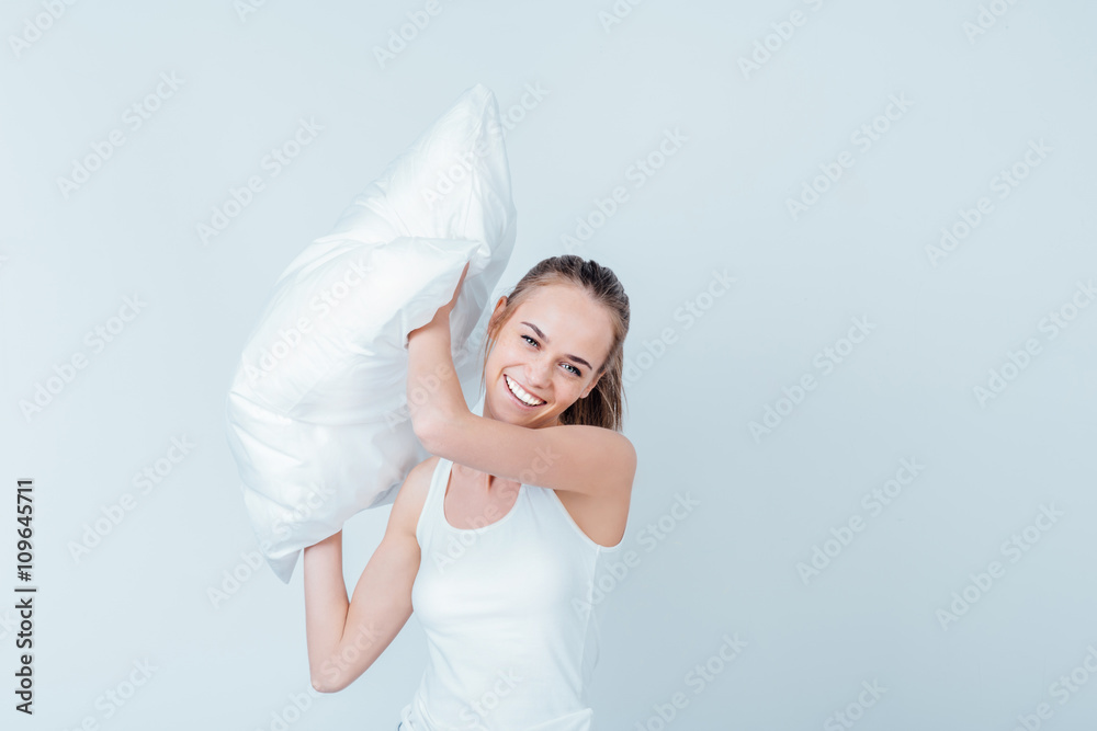 Joyful girl with pillow Joyful girl with pillow