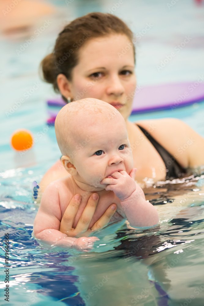 baby girl enjoying her first swim with her mom baby girl enjoying her first swim with her mom