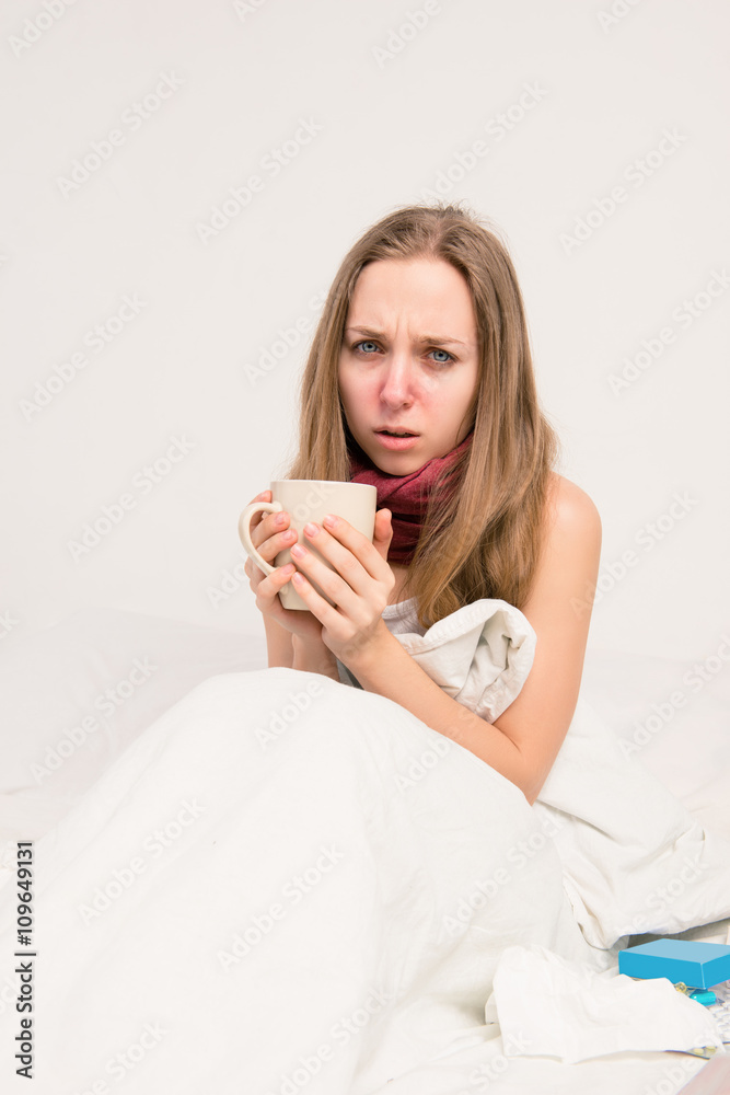 Portrait of upset sick woman with grippe holding cup of hot tea Portrait of upset sick woman with grippe holding cup of hot tea