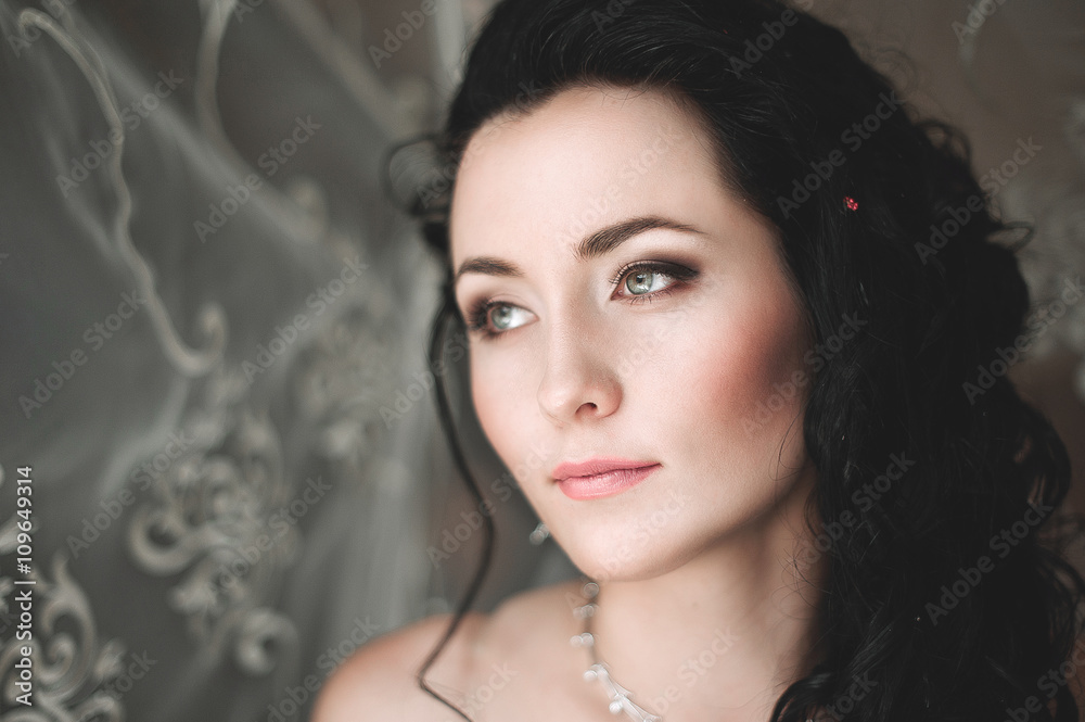 Portrait of beautiful bride with fashion veil posing at home at Portrait of beautiful bride with fashion veil posing at home at
