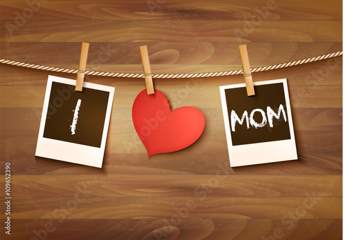 Photos hanging on a clothesline, spelling out I love mom. Mother