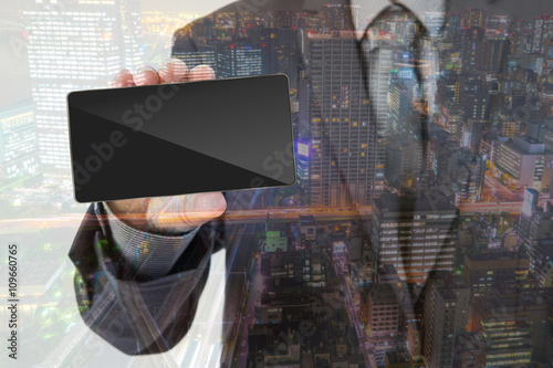 Double exposure of Business man Hand holding mobile smart phone