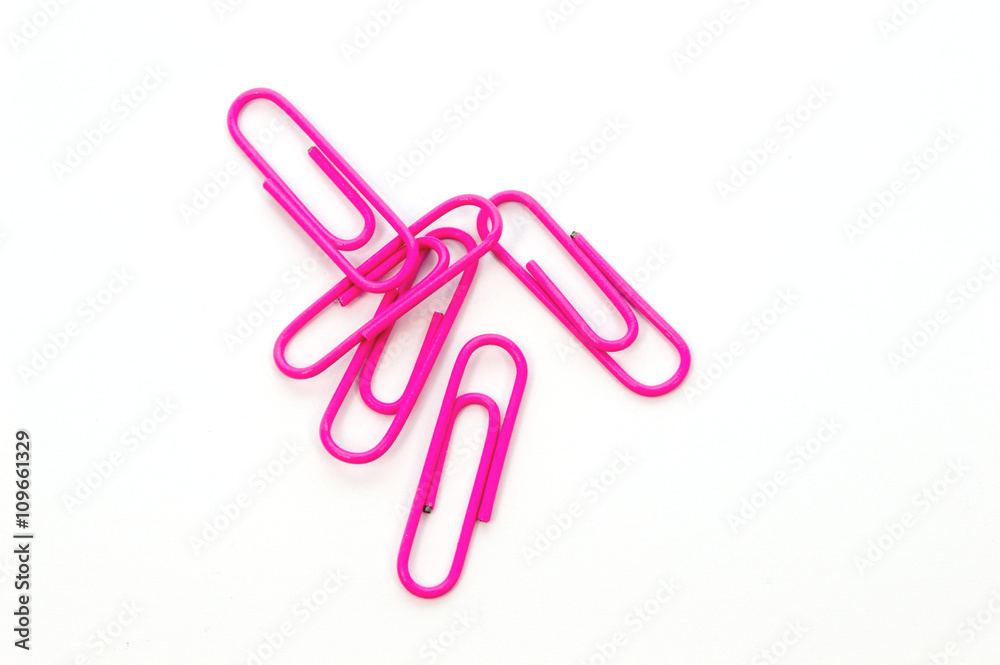 Pink paper clip on white background Pink paper clip on white background
