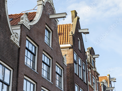 AMSTERDAM, NETHERLANDS on MARCH 28, 2016. Typical architectural details of houses XVII-XVIII of construction. photo