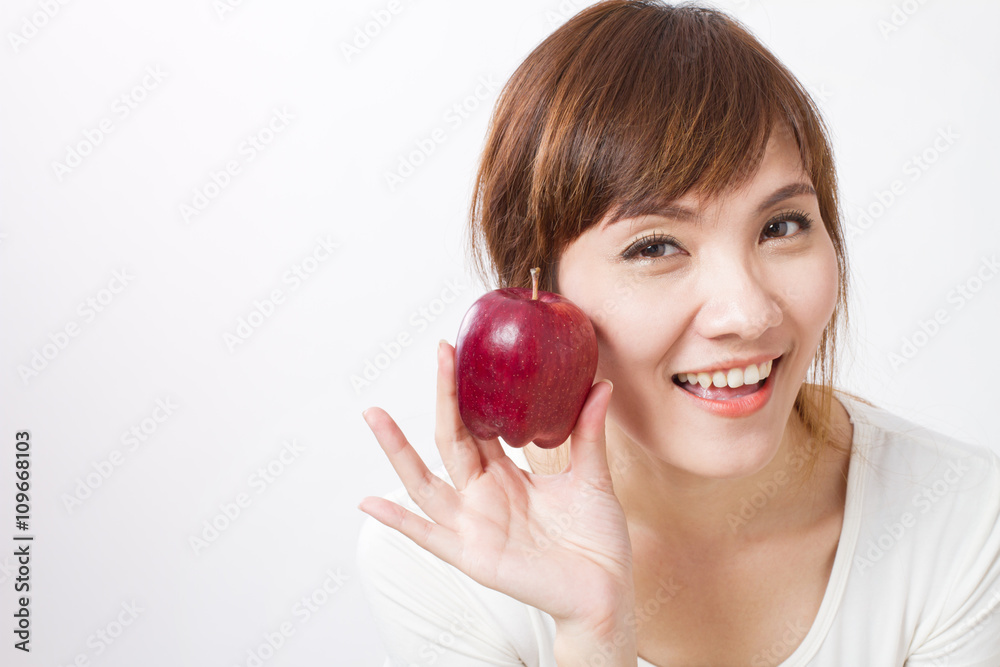 healthy asian woman with red apple, looking at you healthy asian woman with red apple, looking at you