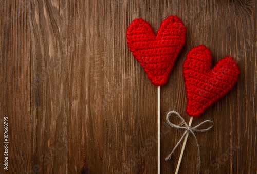 red hearts on wooden background