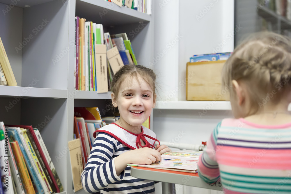 Fototapeta premium girls in children's library