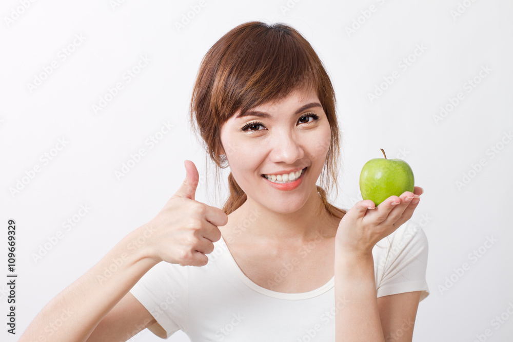 healthy woman giving thumb up with green apple healthy woman giving thumb up with green apple