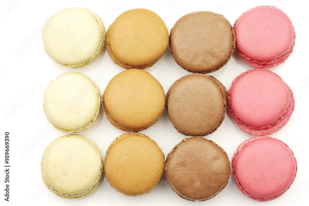 assorted freshly baked macarons on a white background assorted freshly baked macarons on a white background