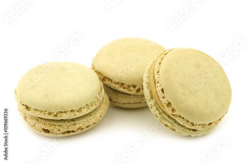 colorful freshly baked macarons on a white background