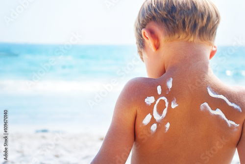 Suntan Boy Sign Wave Sun Cream Sea Background photo