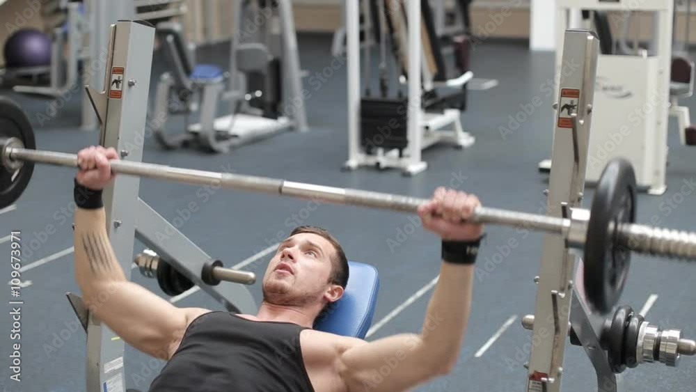 Man bench pressing weights Man bench pressing weights
