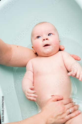 Baby girl taking a bath