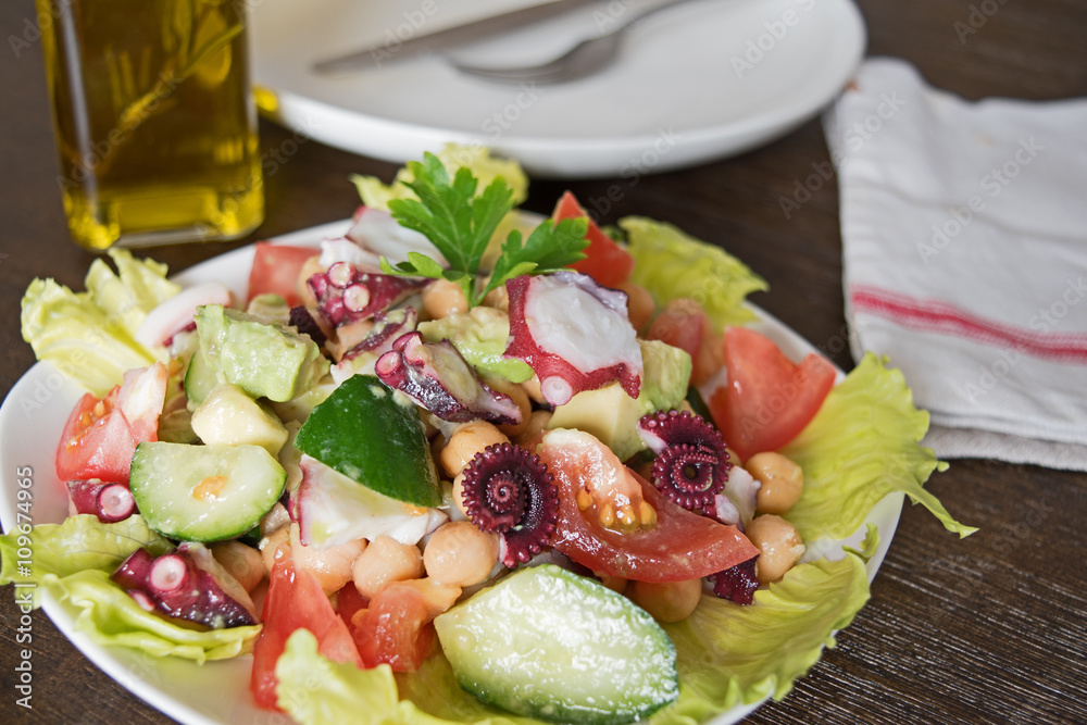 Delicious salad with Octopus and vegetables