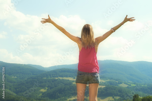 Girl enjoying and feeling free in the nature.