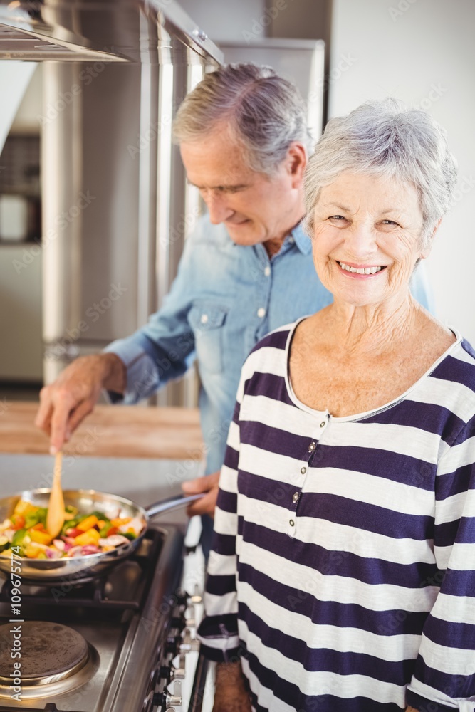 Portrait of senior woman standing with husband 