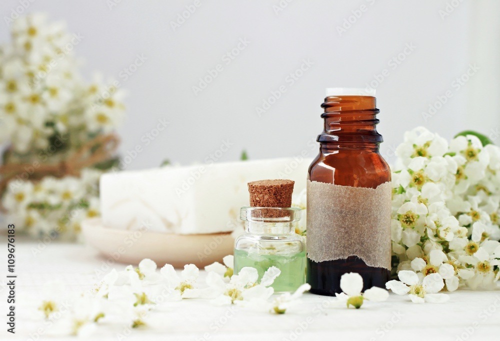 Facial aroma water in bottles, fresh spring cherry tree blossom. Pure cosmetics. Facial aroma water in bottles, fresh spring cherry tree blossom. Pure cosmetics.