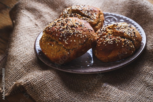 Freshly baked homemade bread on rustic wood background