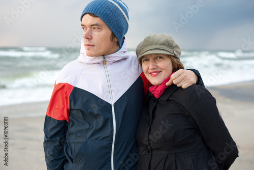 Man and a woman walking on the sea