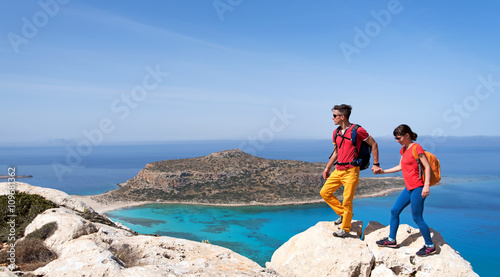 A young couple walking in the mountains