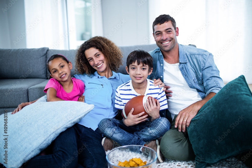 Portrait of family watching american football match Portrait of family watching american football match