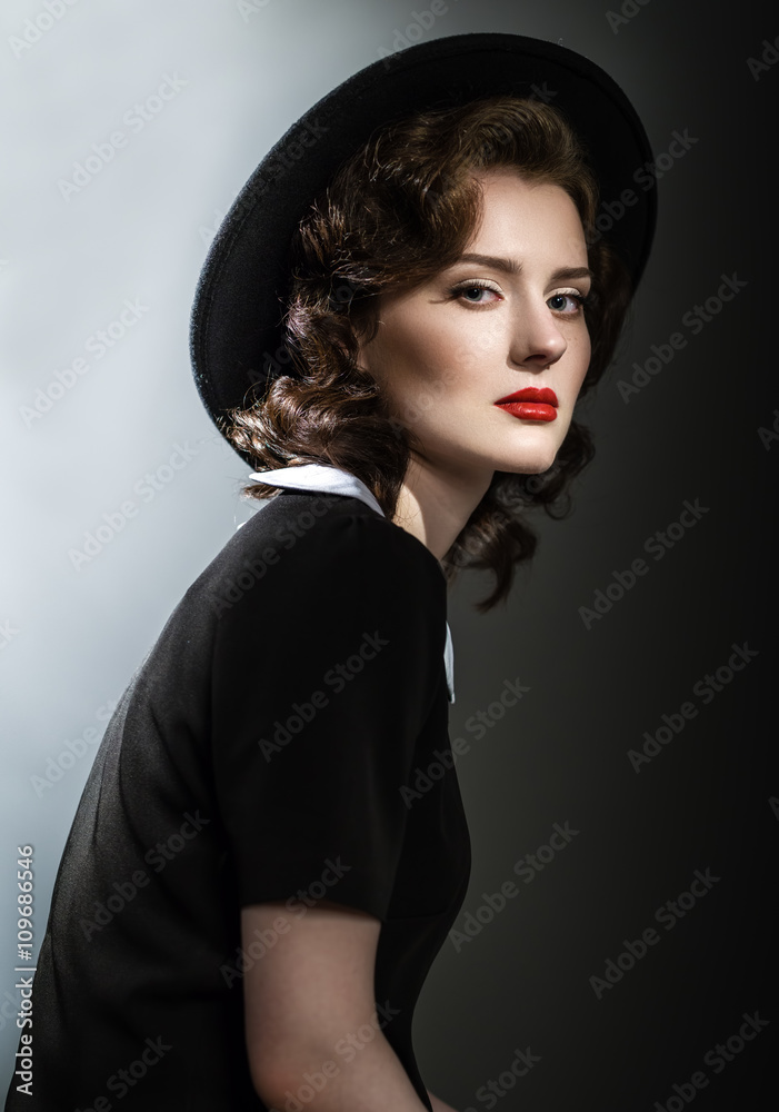Retro classic portrait of elegant woman in black hat and dress Retro classic portrait of elegant woman in black hat and dress