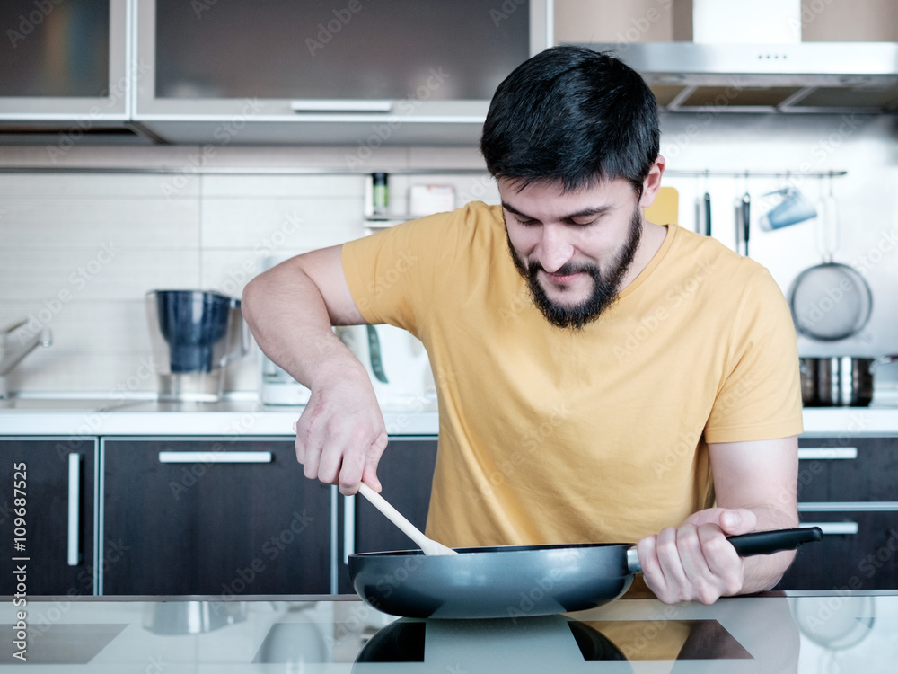 Bearded man in the kitchen