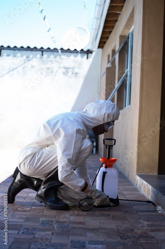 Side view of a man doing pest control © WavebreakMediaMicro