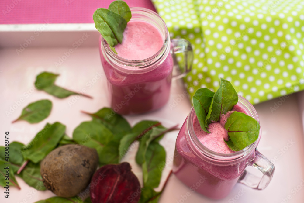 Glass of fresh beetroot juice with bets and leafs . Beetroot smoothie in jar. Pink detox. Eye bird view. Top view. Glass of fresh beetroot juice with bets and leafs . Beetroot smoothie in jar. Pink detox. Eye bird view. Top view.