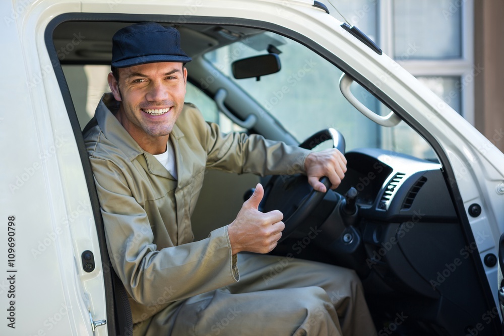 Delivery man sitting in his van Delivery man sitting in his van