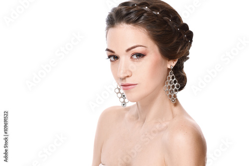 Fashion portrait of young beautiful woman with jewelry. Brunette girl. Perfect make-up. Isolated on white background.