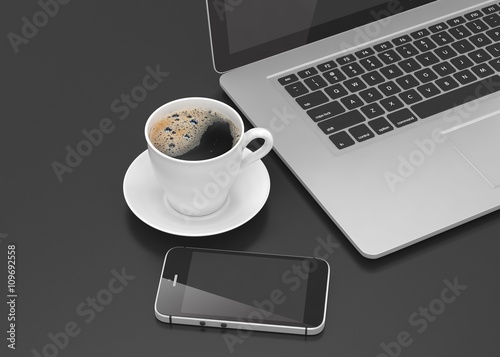 Laptop smartphone and coffee cup on black. 3d rendering.