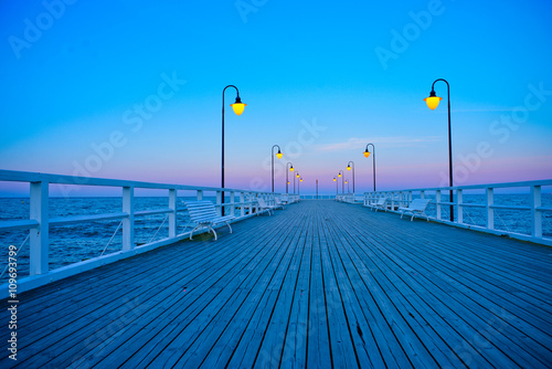 Beautiful wooden pier at sunset