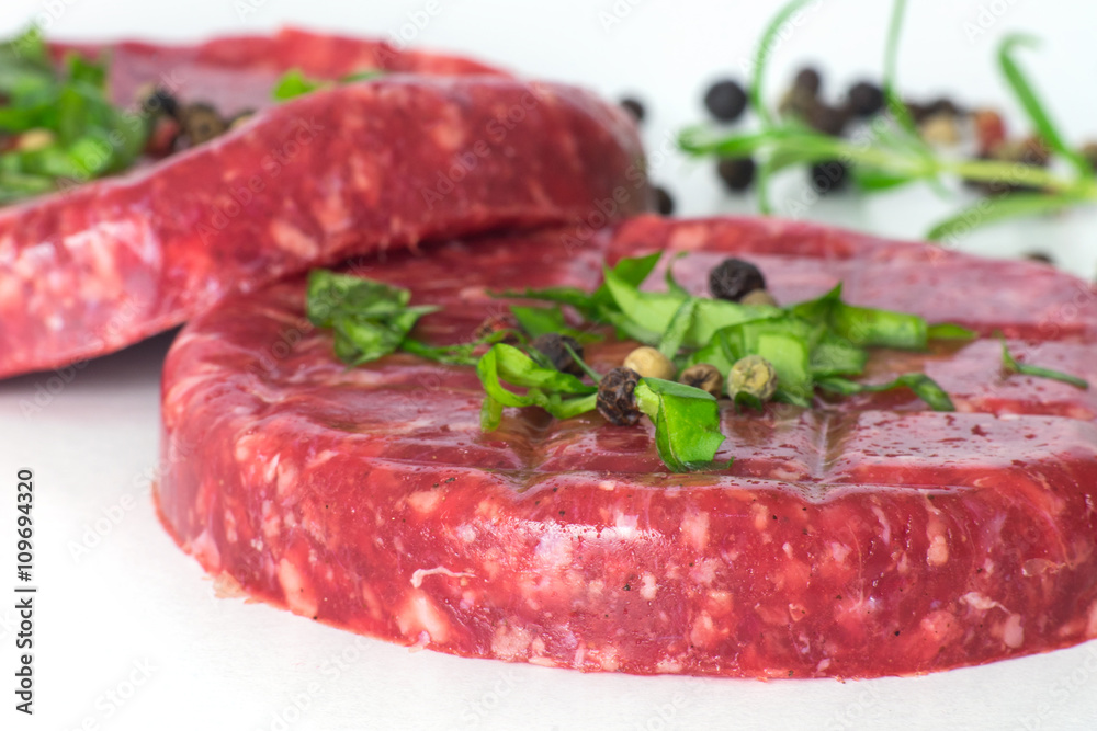 Raw beef hambuger isolated on white background Raw beef hambuger isolated on white background