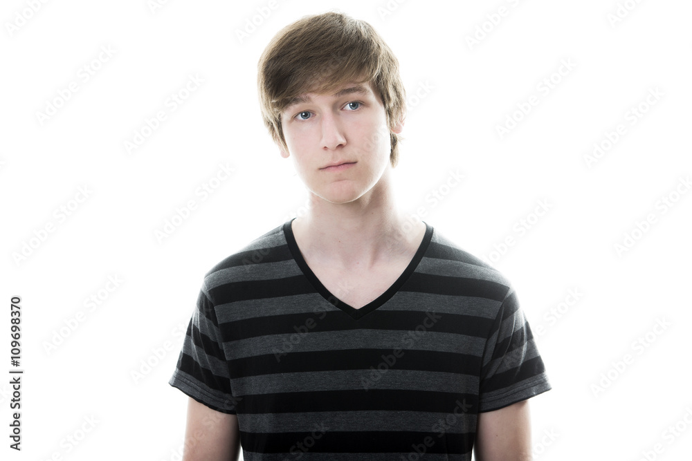 young teenage boy being photographed in a studio. young teenage boy being photographed in a studio.