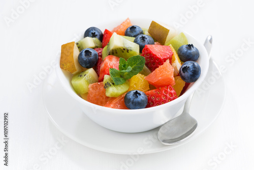 Delicious fruit salad on white table, closeup