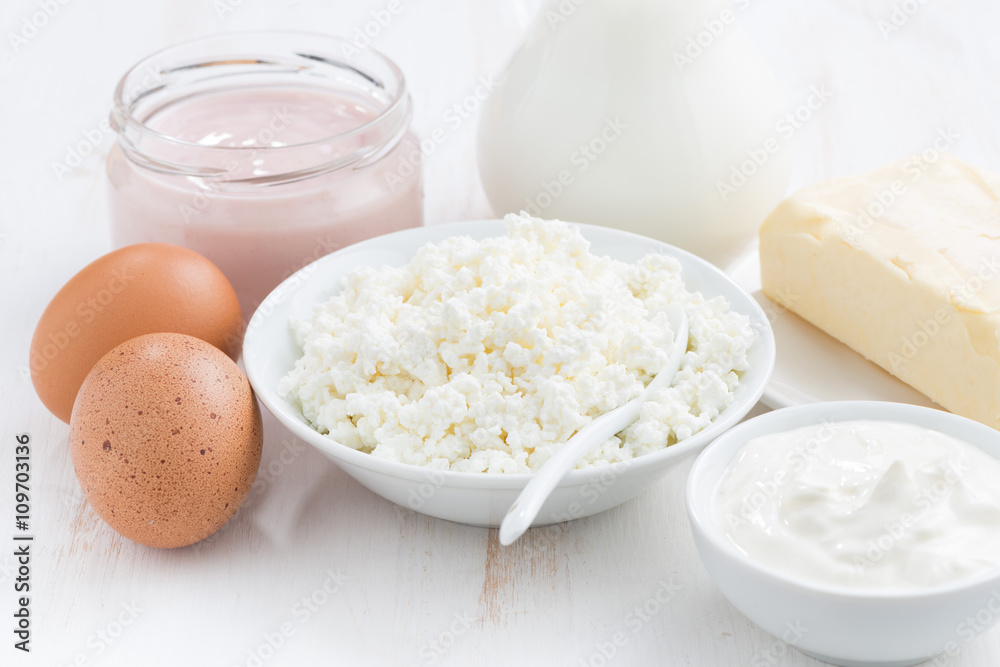 fresh dairy products on white wooden table, closeup