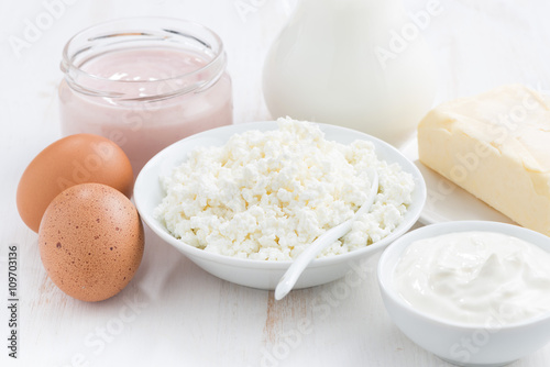 fresh dairy products on white wooden table, closeup