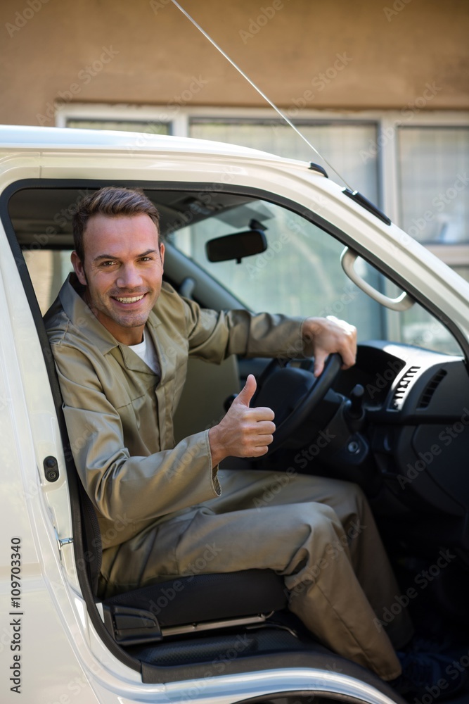 Delivery man sitting in his van Delivery man sitting in his van