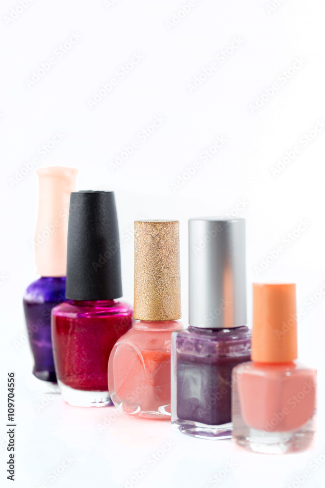 colored nail polish standing isolated on white background colored nail polish standing isolated on white background