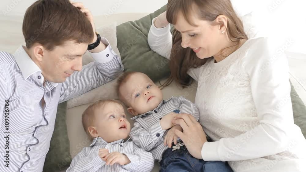 Happy family portrait. Parents with baby boy twins. Happy family portrait. Parents with baby boy twins.