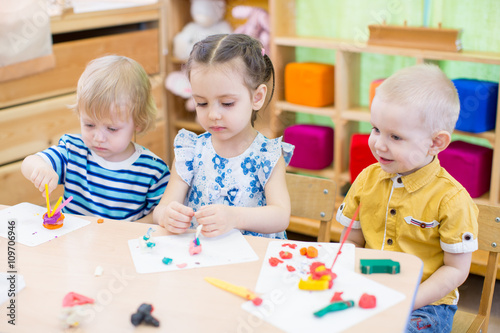 kids learning arts and crafts in kindergarten