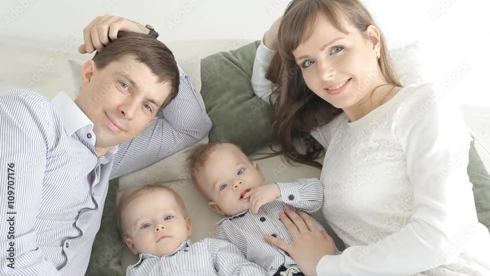 Happy family portrait. Parents with baby boy twins. Happy family portrait. Parents with baby boy twins.