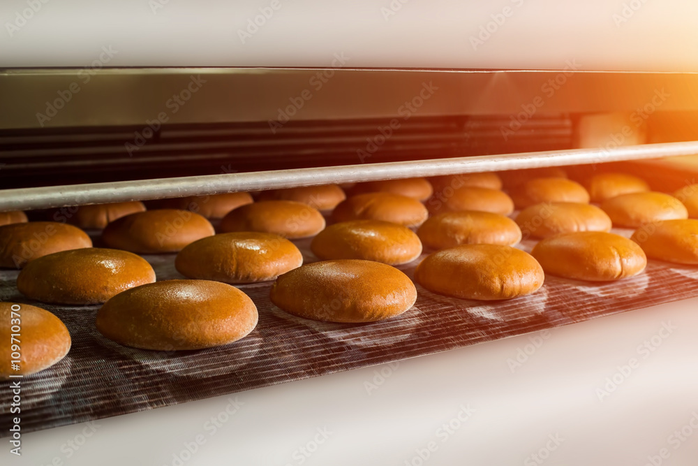 Brown Bread Loaves On Conveyor Conveyor With Round Bread Loaves Baked