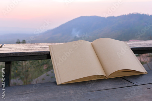 Big brown notebook blank open on terrace