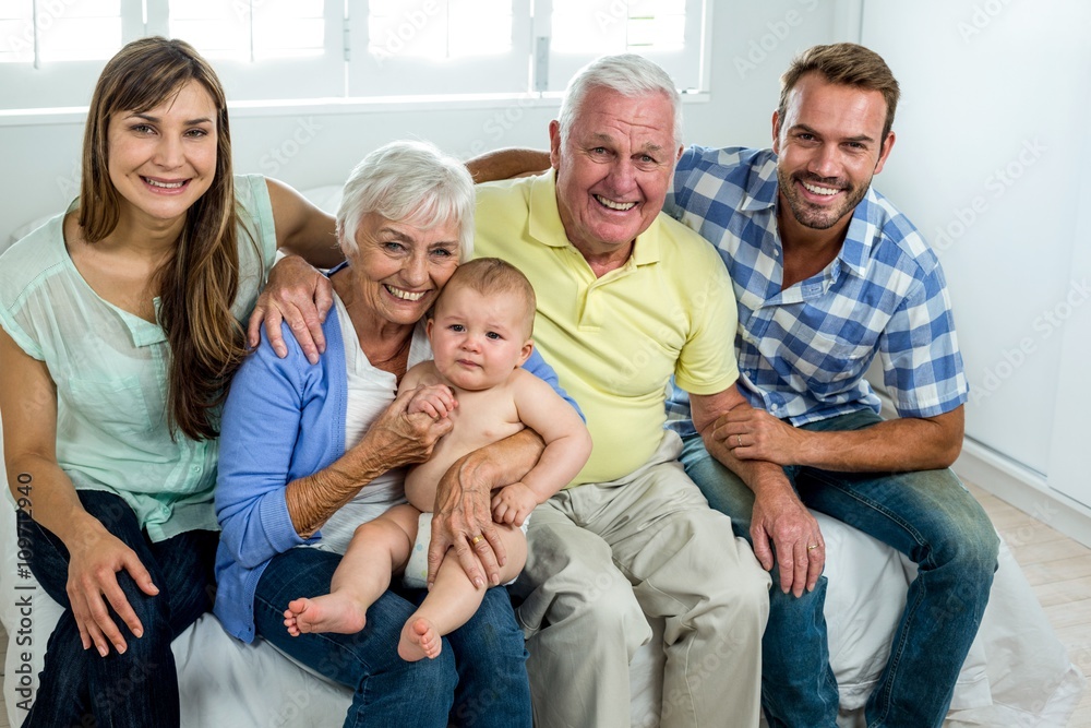 Happy multi-generation family on bed at home Happy multi-generation family on bed at home